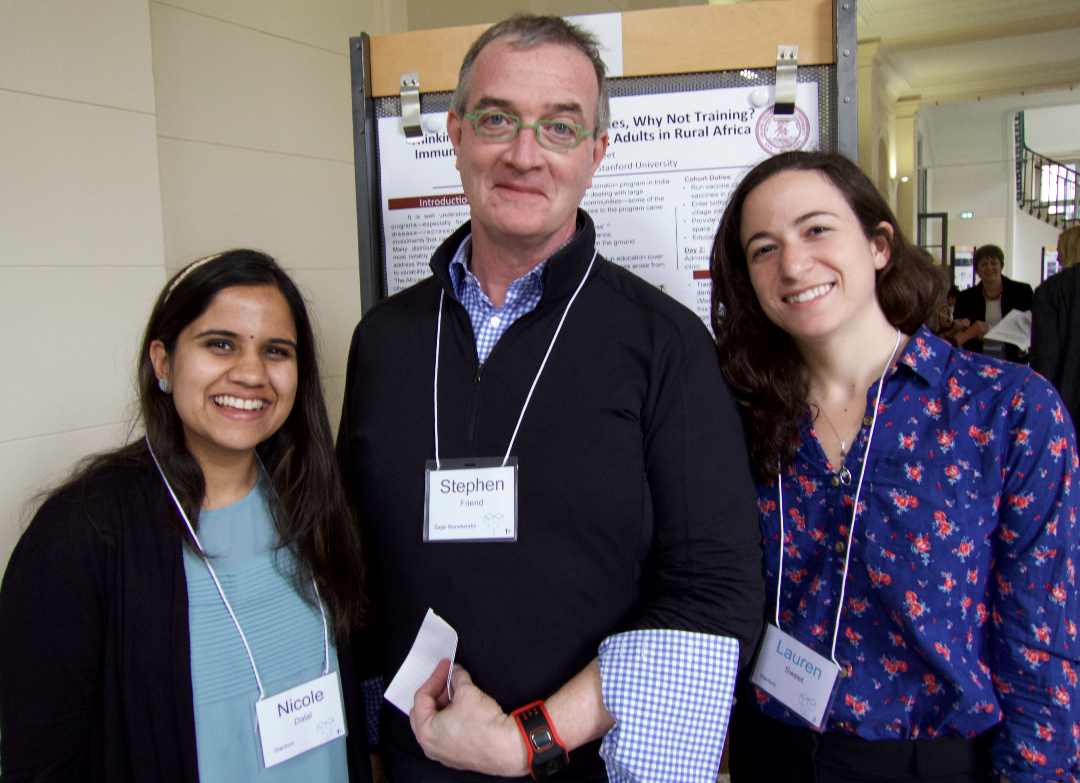 Sage Scholars Nicole Dalal and Lauren Sweet, from Stanford University, flank Stephen Friend at the Paris Sage Assembly, April 16, 2015.