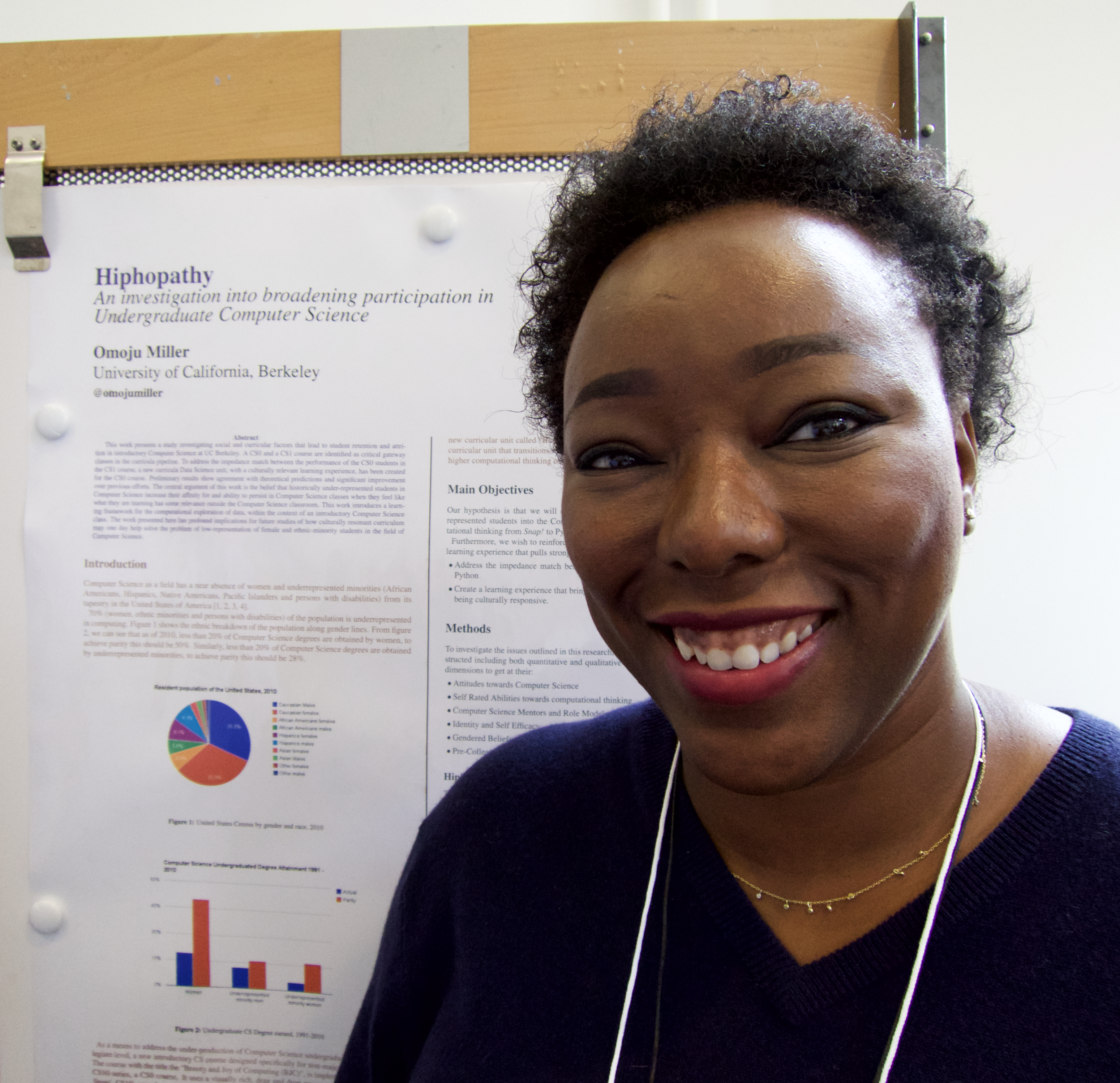 Sage Scholar Omoju Miller, from the University of California at Berkeley, is shown with her poster at the Paris Sage Assembly, April 16, 2015.